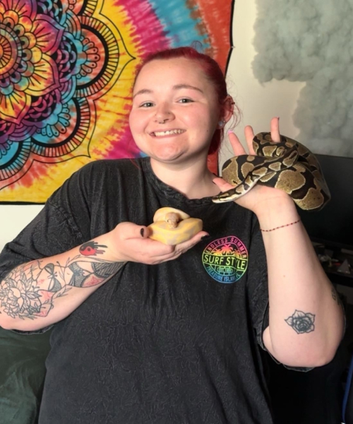 Mackenzie holding two snakes in her hands
